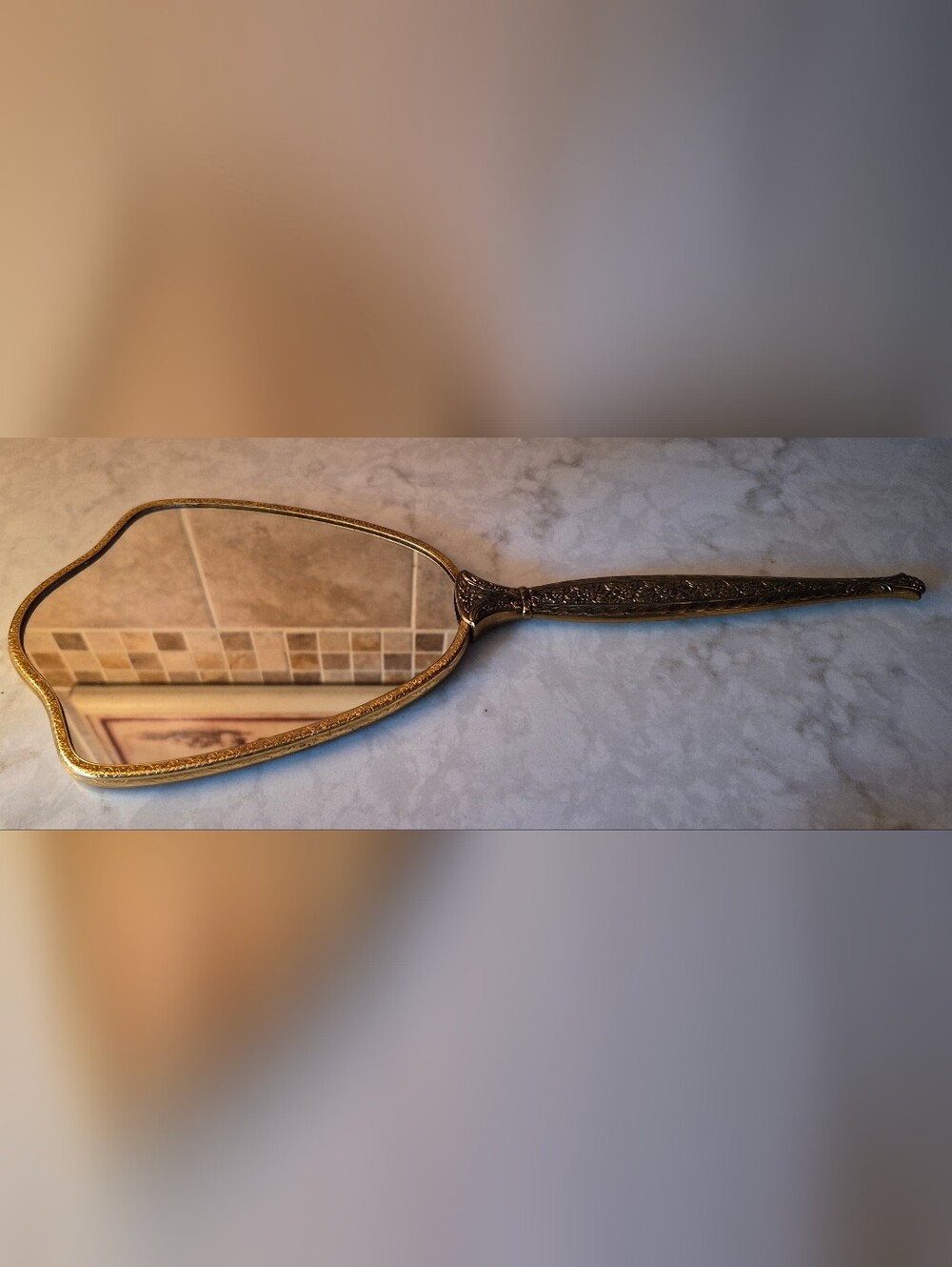 Vintage Hollywood Regency hand-held vanity mirror